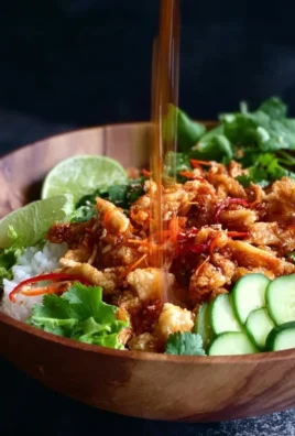 Bang Bang Chicken Crispy Rice Salad served in a vibrant bowl with fresh ingredients.
