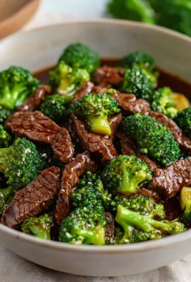 Beef and broccoli stir-fry in a vibrant sauce served with rice
