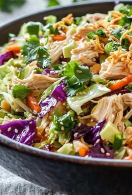 Bowl of vibrant Chinese Chicken Salad with colorful vegetables and grilled chicken