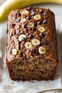 Moist chocolate chip banana bread loaf with fresh bananas and chocolate chunks