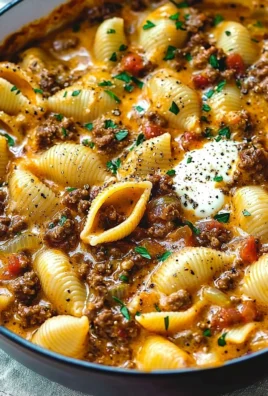 Creamy beef and shells dish garnished and served in a bowl