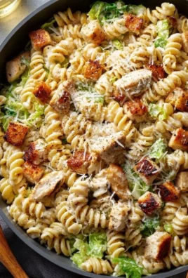 Creamy chicken pasta dish with herbs and cheese