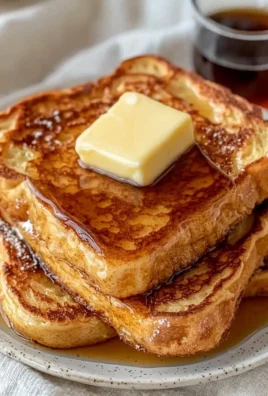 Delicious plate of easy French toast topped with syrup and fresh berries