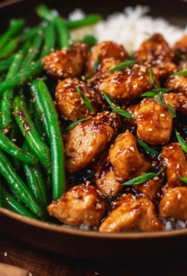 Honey Garlic Chicken served with fresh green beans on a plate
