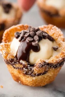 Delicious mini cannoli cups filled with sweet ricotta cream and chocolate chips.