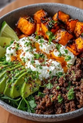Ground Beef Hot Honey Bowl topped with green onions and served in a white bowl