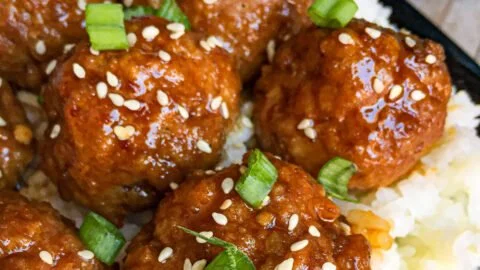 Delicious Asian glazed meatballs served on a platter with garnish
