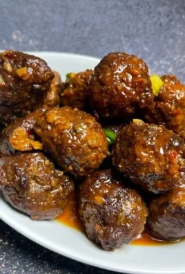 Plate of Asian meatballs served with sweet chili sauce