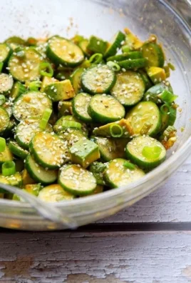 Asian-style cucumber avocado salad with fresh ingredients and vibrant colors