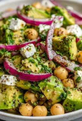 Chickpea Feta Avocado Salad with fresh ingredients in a bowl