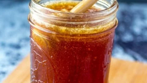 Jar of Chile Infused Honey showcasing its vibrant color and spicy ingredients