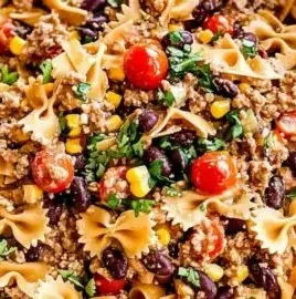 Creamy Cowboy Pasta Salad with colorful ingredients served in a bowl
