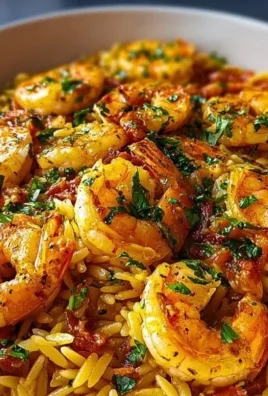 Creamy shrimp orzo dish with shrimp, orzo pasta, and herbs