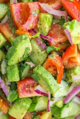 Cucumber Tomato Avocado Salad with fresh vegetables and herbs