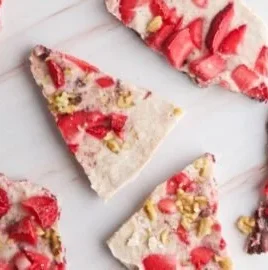 Delicious frozen yogurt bark topped with fresh berries