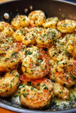 Delicious Garlic Parmesan Shrimp served on a plate, garnished with parsley.