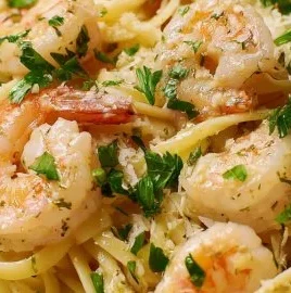 Delicious Garlic Shrimp Pasta served in a bowl with herbs and parmesan cheese
