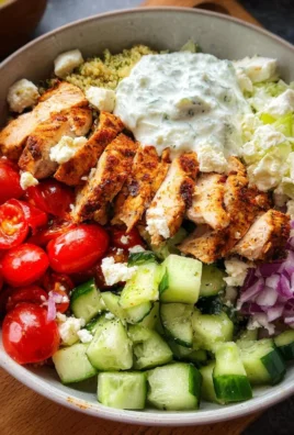 Delicious Greek Chicken Bowls with fresh vegetables and toppings