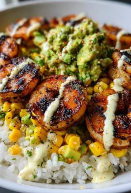 Delicious grilled shrimp bowl with avocado corn salsa served in a vibrant dish