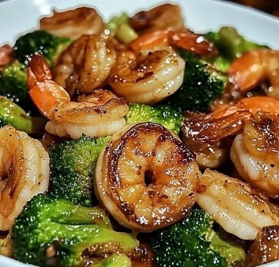 High-protein honey garlic shrimp dish served with vegetables on a plate