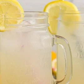 Refreshing homemade lemonade served in a glass with a lemon slice