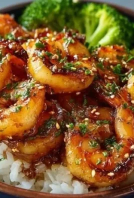 Honey Garlic Shrimp served in a bowl with vegetables and rice