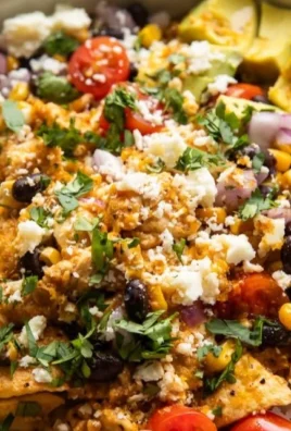 Hot Honey Baja Chicken Bowl with spicy chicken, fresh veggies, and hot honey sauce