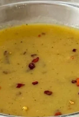 Hot honey mustard sauce in a dipping bowl with a drizzle on a platter