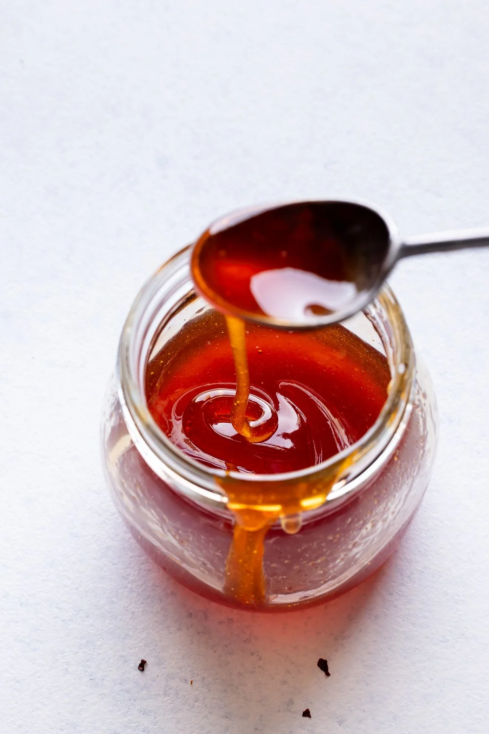 A bowl of homemade hot honey ready to spice up various dishes
