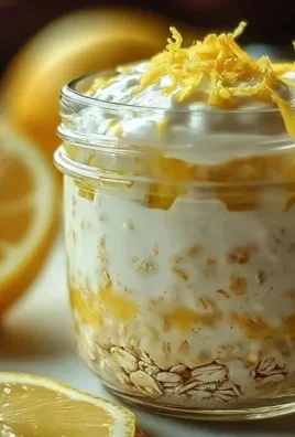 A bowl of lemon cheesecake overnight oats topped with fresh fruit.