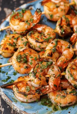 Mediterranean grilled shrimp kabobs on a platter with vegetables