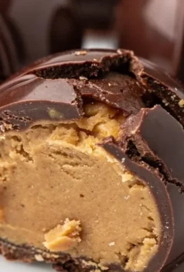 Molten Peanut Butter Chocolate Bomb dessert topped with chocolate and peanut butter