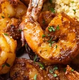 Delicious Moroccan Sweet and Spicy Shrimp served with vibrant spices and herbs.