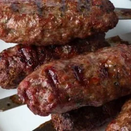 Delicious quick-grilled Greek ground lamb kabobs served on a platter