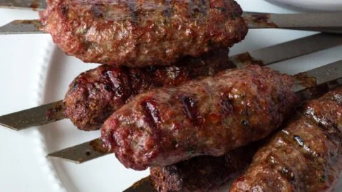Delicious quick-grilled Greek ground lamb kabobs served on a platter
