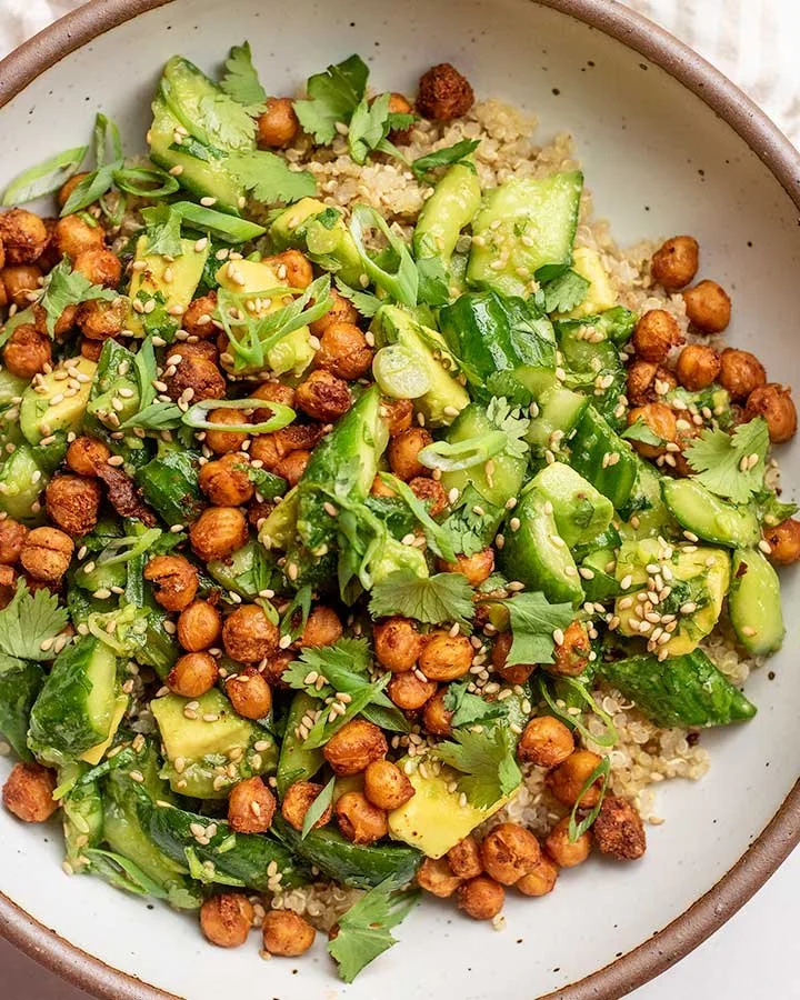 Smashed cucumber avocado salad with fresh ingredients in a bowl