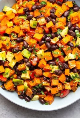 Spicy chipotle roasted sweet potato and black bean salad in a bowl