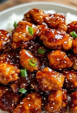 Delicious Sticky Spicy-Sweet Chili Chicken served with garnish