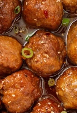 Delicious Sweet and Spicy Meatballs garnished with herbs