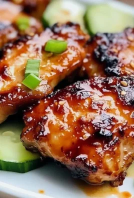 Delicious Sweet Chili Chicken Thighs garnished with fresh herbs