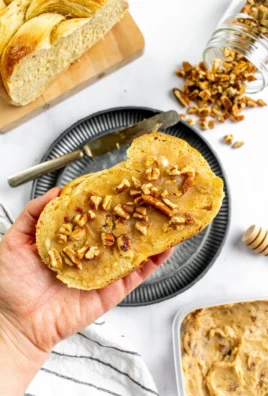 Toasted butter pecan honey butter spread on freshly baked bread