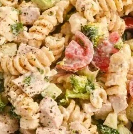 Creamy high-protein pasta salad with chicken served in a bowl