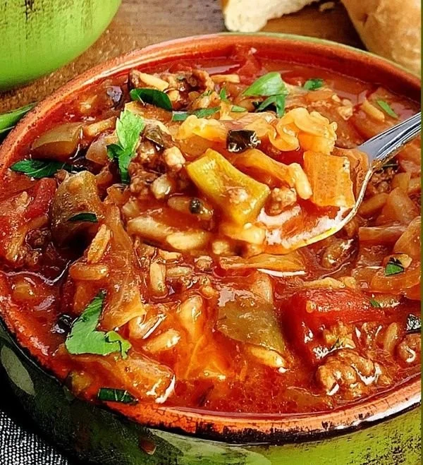 Bowl of easy stuffed cabbage soup with fresh ingredients and herbs