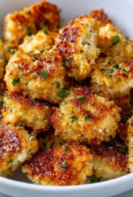 Crispy Garlic Parmesan Chicken Bites cooked in an air fryer for a delightful meal.