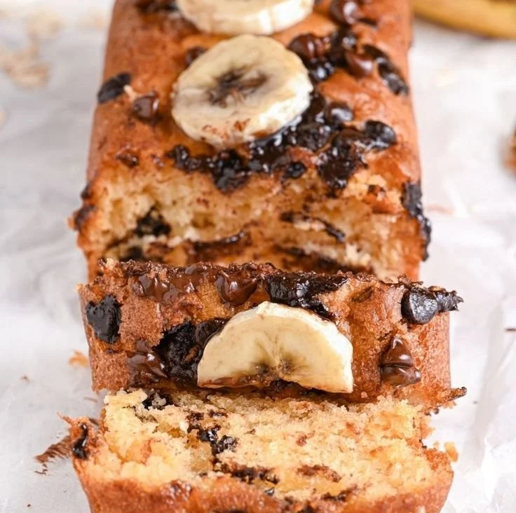 Delicious Greek Yogurt Banana Bread slice on a wooden table