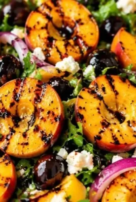 Delicious grilled peach salad with fresh greens and summer ingredients
