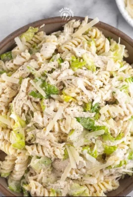 High protein chicken Caesar salad pasta with fresh ingredients