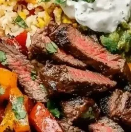 High protein low carb steak fajita bowl with colorful veggies and toppings