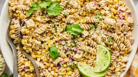 Delicious High Protein Street Corn Pasta Salad served in a bowl with fresh toppings