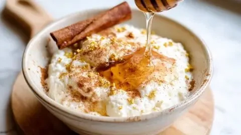 Honey cinnamon cottage cheese bowl topped with a sprinkle of cinnamon